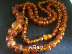 A Long Strand Of Faceted Carved Natural Baltic Honey Amber Beads 37ins 77 Grams