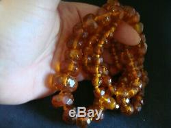 A Long Strand Of Faceted Carved Natural Baltic Honey Amber Beads 37ins 77 Grams