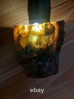 C Baltic natural, unprocessed amber. Mat. Landscape. Weight 235 grams
