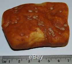 Natural Baltic Amber Stone. Egg Yolk/Butterscotch/Brindled color. 66,5 gr (a448)