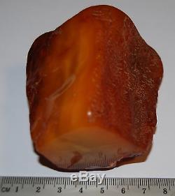 Natural Baltic Amber Stone. Egg Yolk/Buttescotch/Brindled color. 133 g (a442)