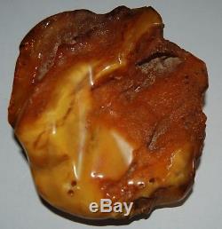 Natural Baltic Amber Stone. EggYolk/Brindled color. 215 gr (a1054)