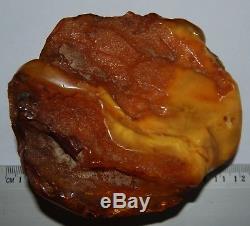Natural Baltic Amber Stone. EggYolk/Brindled color. 215 gr (a1054)