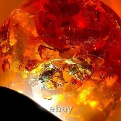 Spectacular Baltic amber ball with honey bees, ø ±93 mm ±530 grams